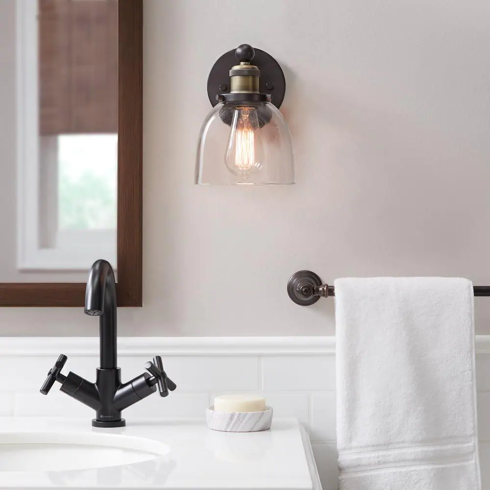 Home Decorators Collection Evelyn 6 in. 1-light Light Bronze Modern indoor vanity with Clear Glass Shade